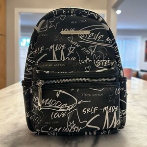 Steve Madden graffiti black/white mini backpack